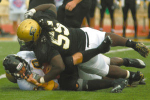 Defensive Lineman Harold Ayodele takes a Fort Hays State University runner Saturday afternoon at Welch Stadium. Ashley Wells/ The Bulletin