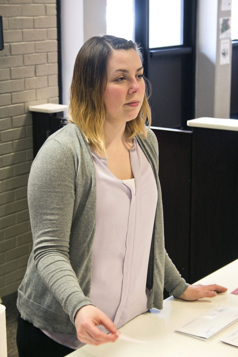 Stephanie Stauffer, complex coordinator of freshmen dorms, sorts mail yesterday at the towers&#8217; front desk. When the law carries out after July 1st, ESU residence halls will allow concealed carry, though Captain Chris Hoover states that the policy will require residences to secure weapons in the dorms.