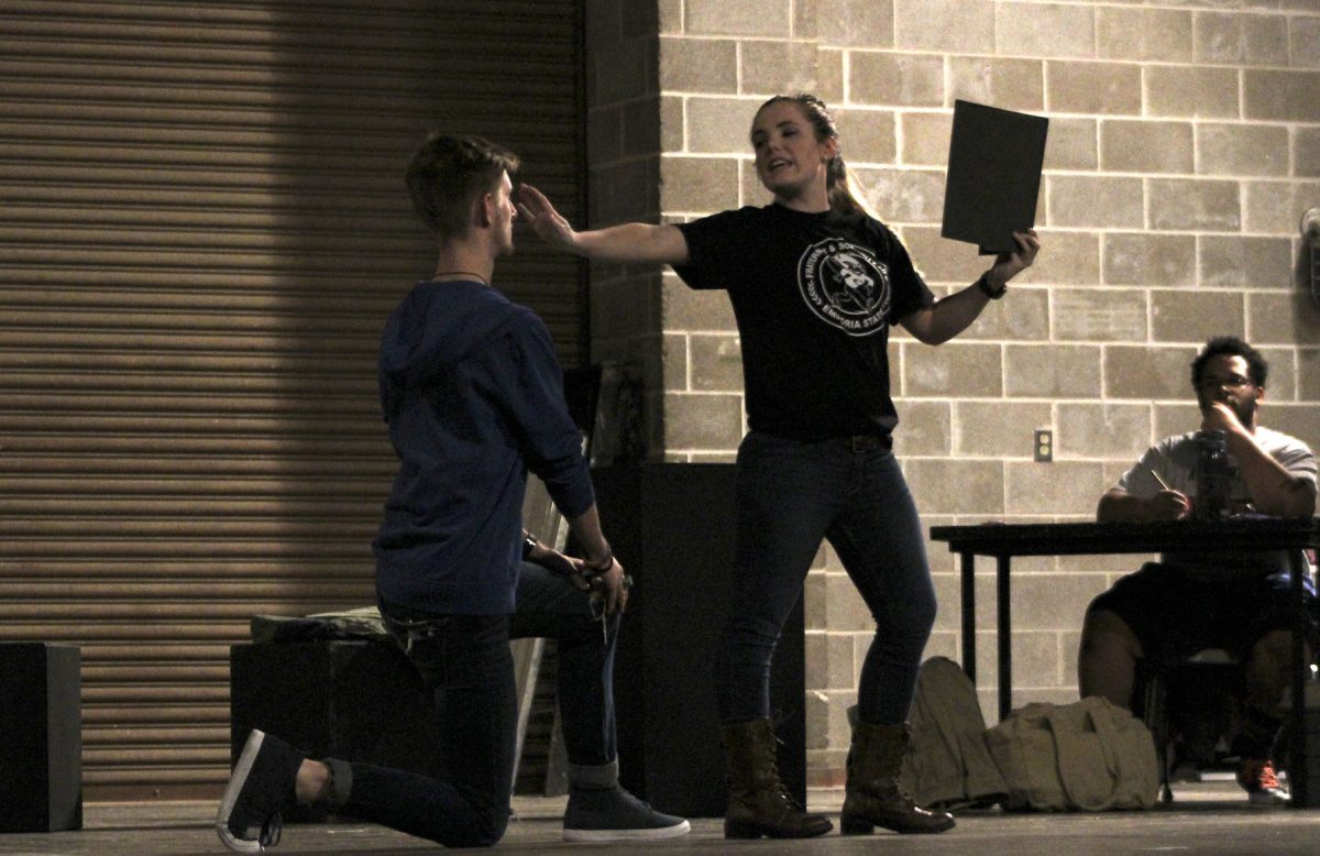 Alec Walberg, freshman theatre major, and Katie Pelegrin, sophomore theatre major, act out a scene in which their characters reenact lines from a Shakespeare play at rehearsal for &#8220;Six Characters in Search of an Author&#8221; on Thursday in King Hall. The play is directed by Nathan Short, a student director, and starts at 7:30 p.m. from March 1-4 in the Bruder Theatre.