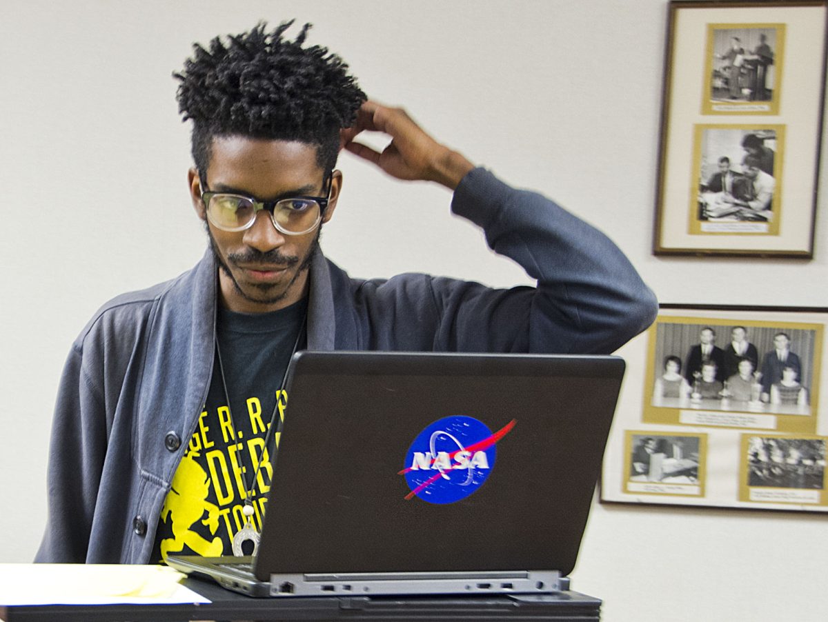 Arriq Singleton, varsity open debater and junior interdisciplinary studies major, practices his debate speech yesterday in King Hall. Singleton and his partner Issie Engelbert, junior pre-art therapy major, recently placed third out of nine teams in the 21st Annual Val Browning Round Robin debate tournament in Ogden, Utah.