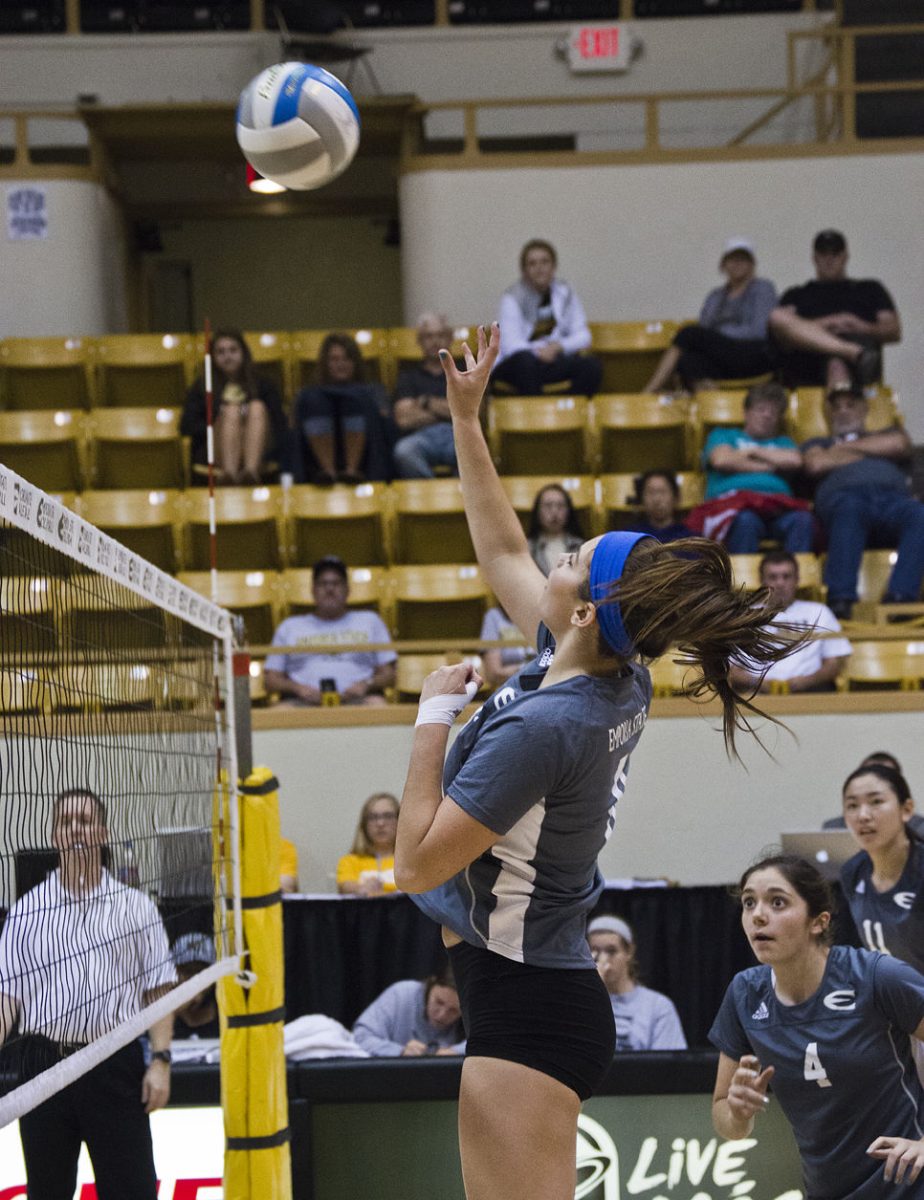 Valerie Golder, freshman hitter, tips the ball during a match against Southwest Baptist University Saturday at White Auditorium. The Hornets won 3-1.