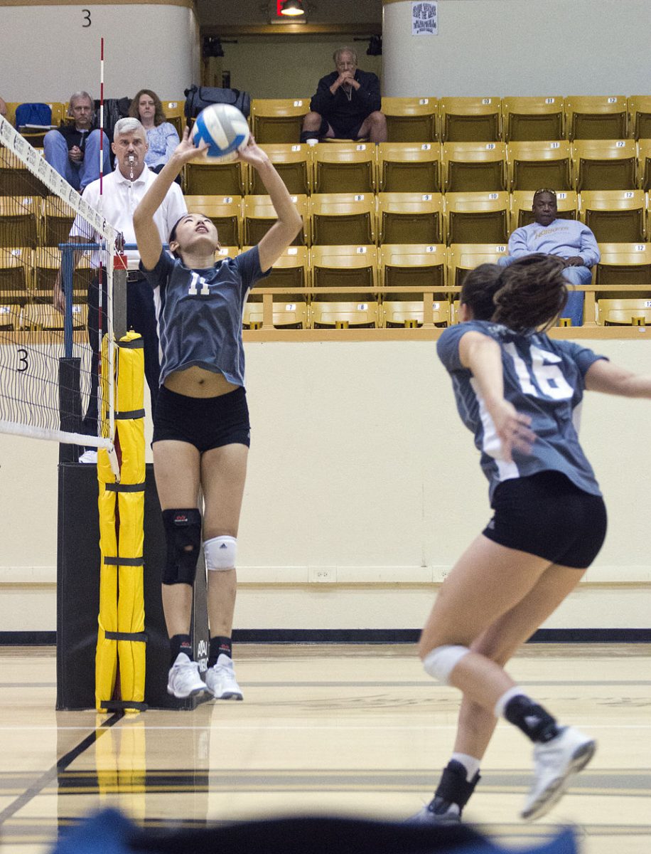 Yuchen Du, freshman setter, sets the ball for Tatum Graves, junior middle hitter, during the game against Southwest Baptist University on Saturday Oct. 14 at White Auditorium. Emporia State recruited Du from her home town, Beijing.