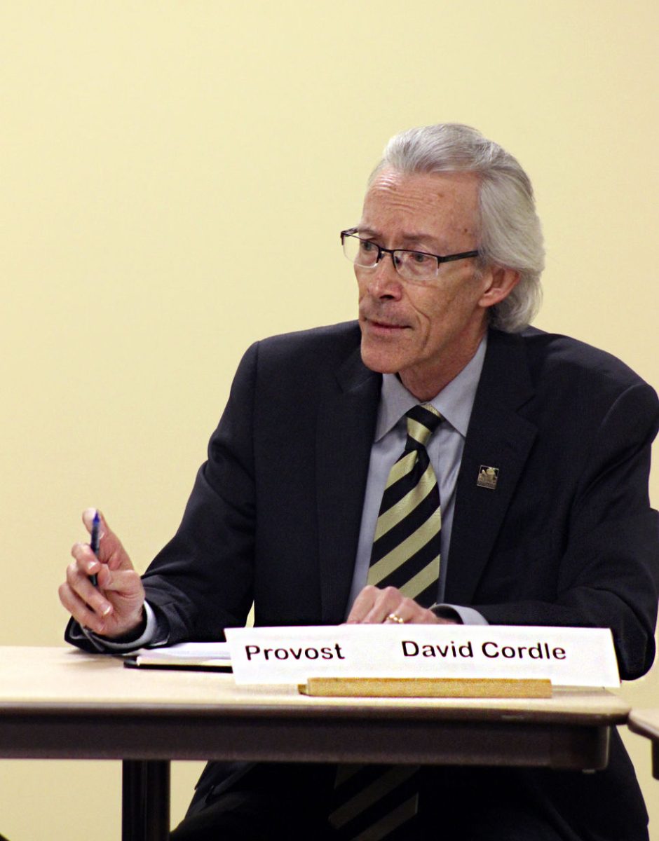 David Cordle, provost, speaks at Tuesday&#8217;s Faculty Senate meeting in the Preston Family Room about academic partnerships. The university is considering partnering with the company to assist faculty in online courses and to raise enrollment and revenue.