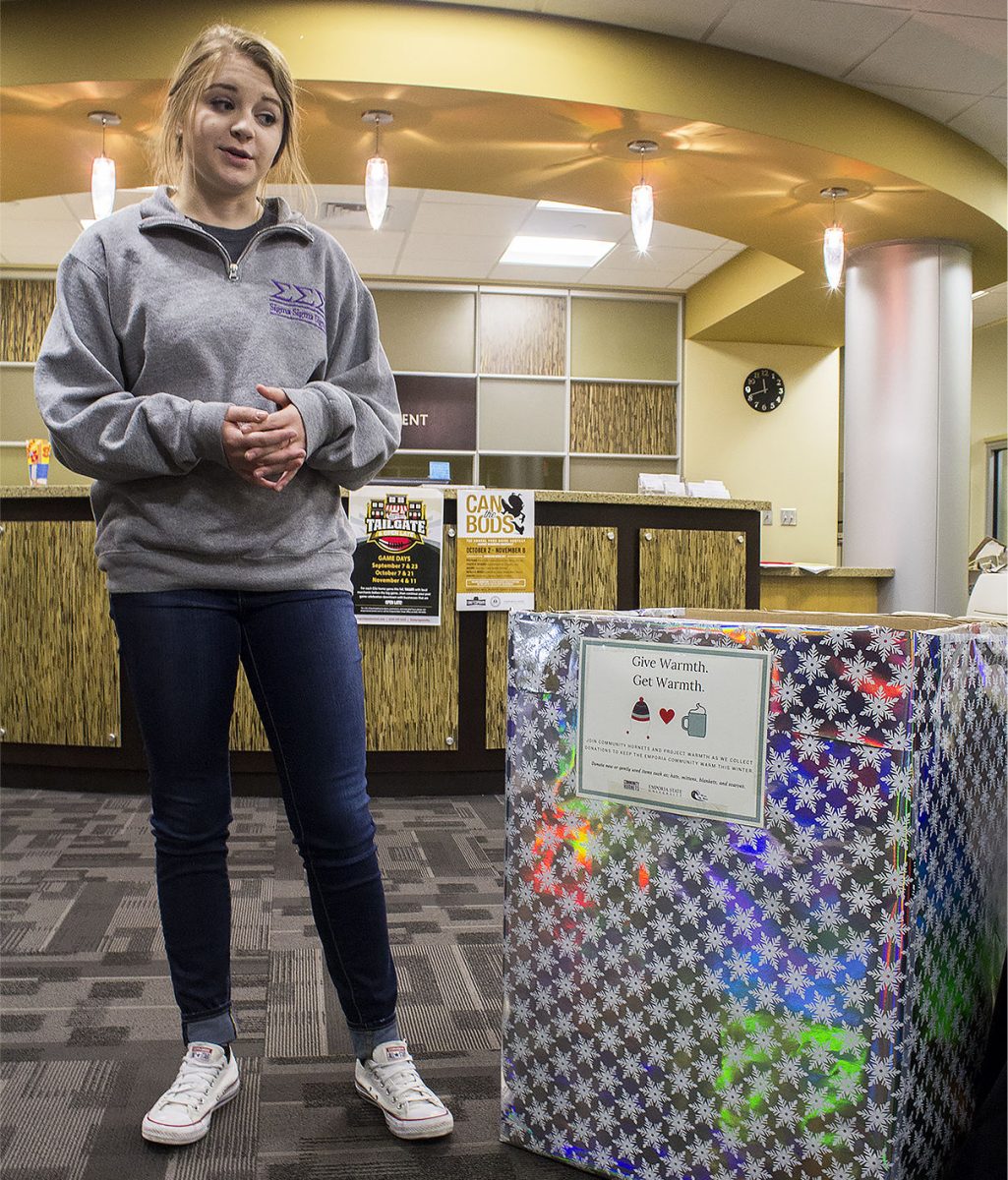 Katie Ollenburger, community hornets coordinator and junior elementary education major, talks about how important it is for students to donate warm clothes. Donation boxes can be found in every building on campus.
