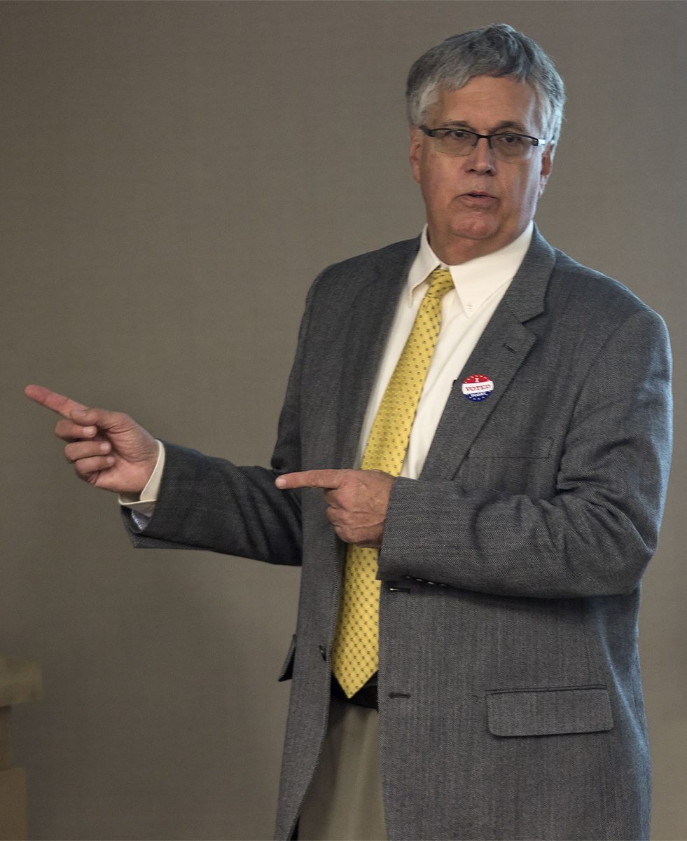 Kevin Johnson, general counsel, leads a presentation about the weapons policy on campus with Carrie Boettcher, emergency manager. According to Johnson, the biggest risk of having guns on campus is accidental discharge.