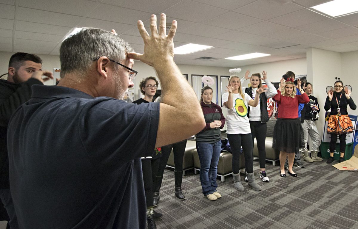 Basil Kessler, assistant professor in counselor education and professor for RE541 Sign II, teaches Halloween themed words on Tuesday in the Earl Center. A group of students is working to formalize the process that allows American Sign Language to count as a general education foreign language credit.