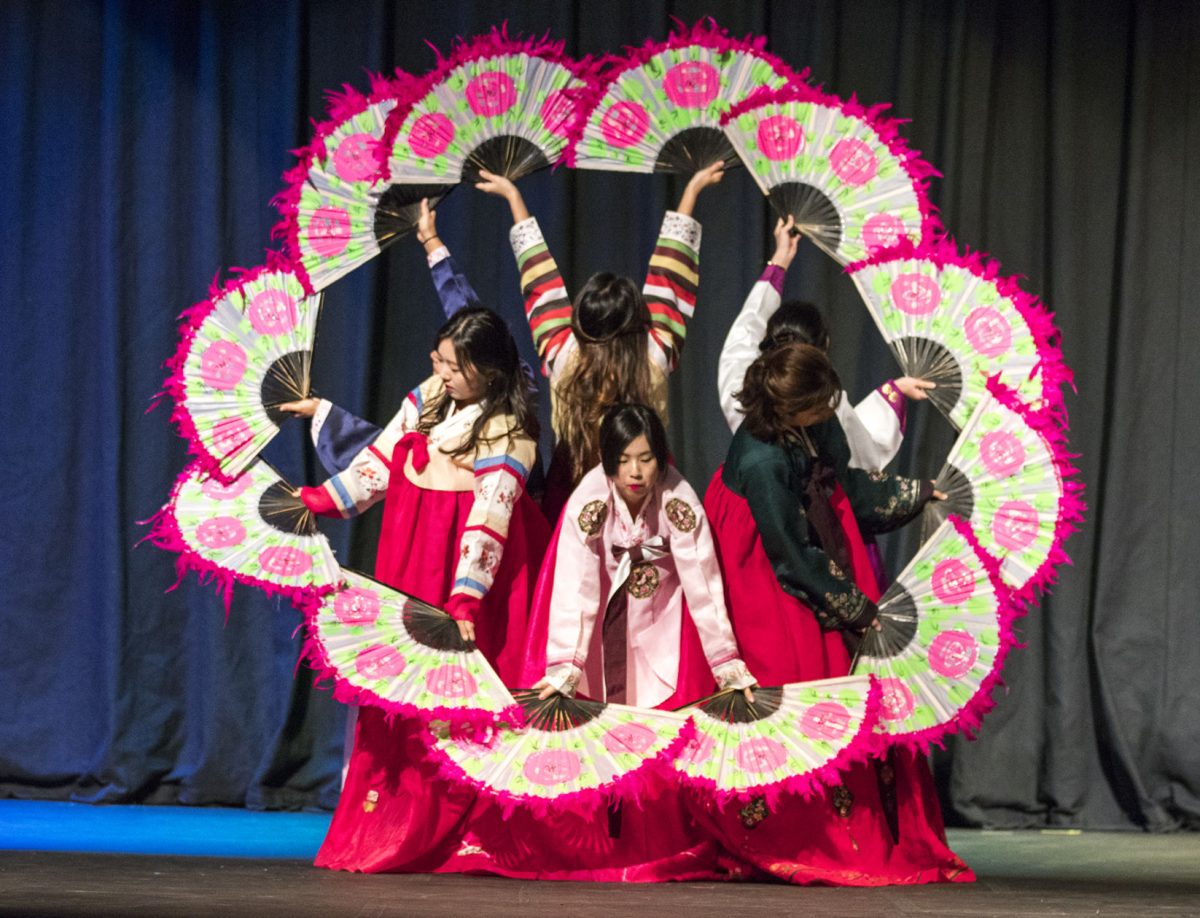 A traditional fan dance is performed by students from The Korean Association during the international cultural show Saturday in Albert Taylor Hall. Many cultures including Chinese, Panamanian and African Carribean participated in the event.