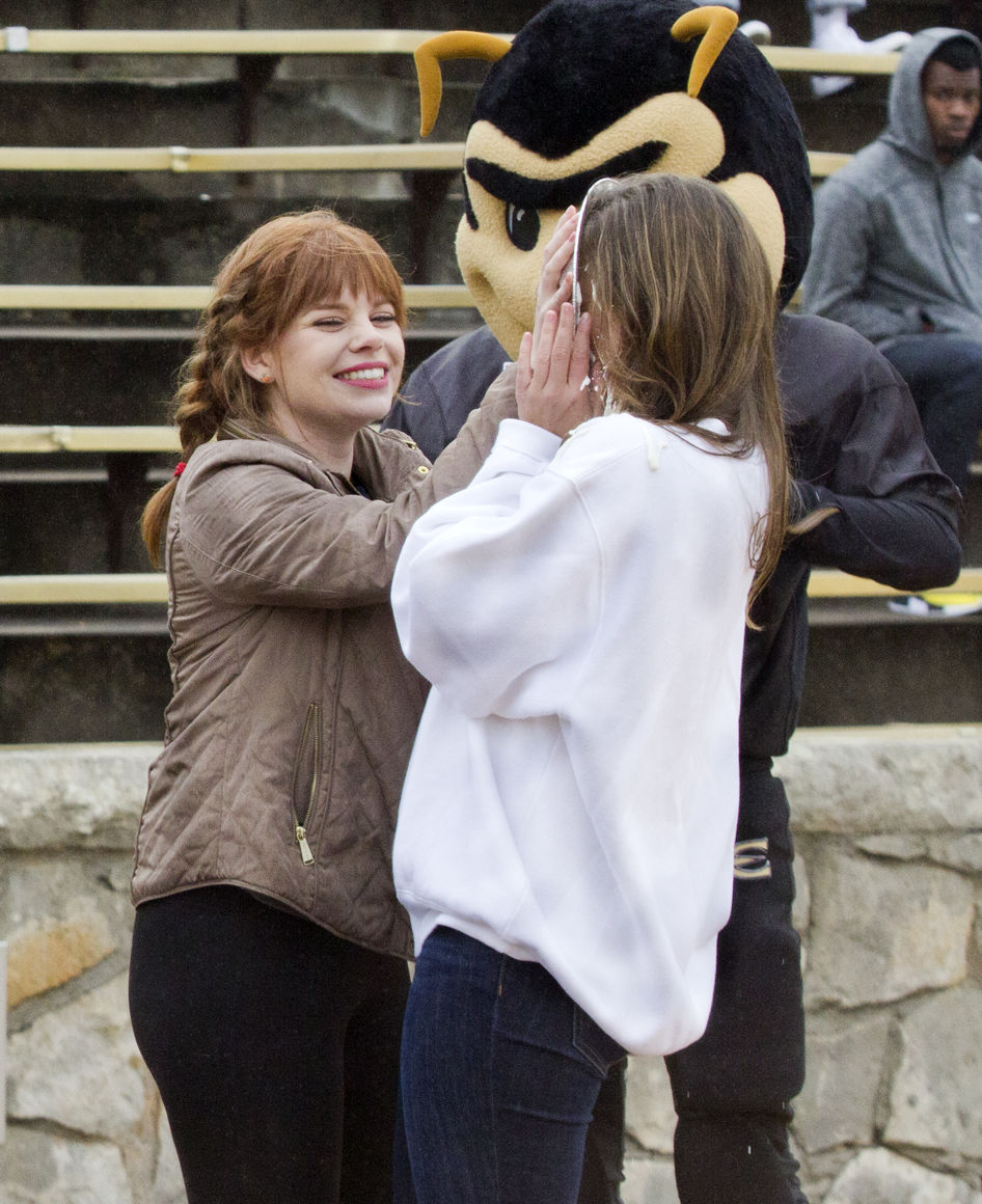 Megan McReynolds, associated student government president and junior sociology major, gets pied by Washburn&#8217;s student body president last Saturday at Welch Stadium. During Can the Bods, ESU collected 40,042 cans, and Washburn collected 44,411 cans.