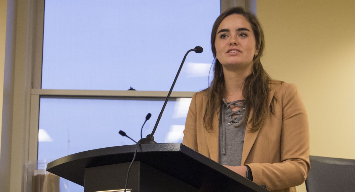 Megan McReynolds, associated student government president and junior sociology major, speaks at the ASG meeting Nov. 16 in the Senate Chambers. A change to the ASG constitution raised the president and executive branch grade point average from 2.7 to 2.85.