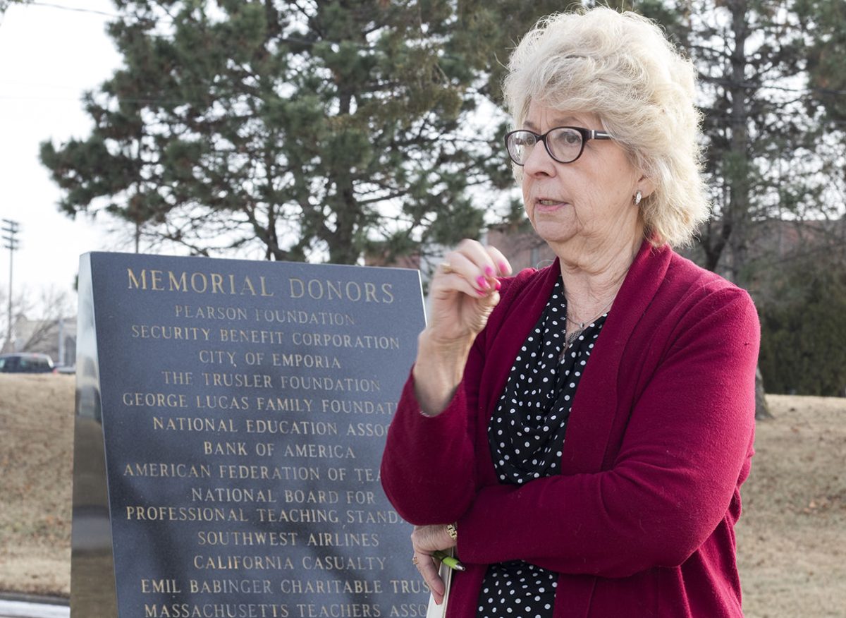 Carol Strickland, executive director of the National Teachers Hall of Fame, gives a tour of the Memorial to Fallen Educators Friday next to the One Room Schoolhouse. The memorial will be designated as a national monument if the bill passes.&#160;
