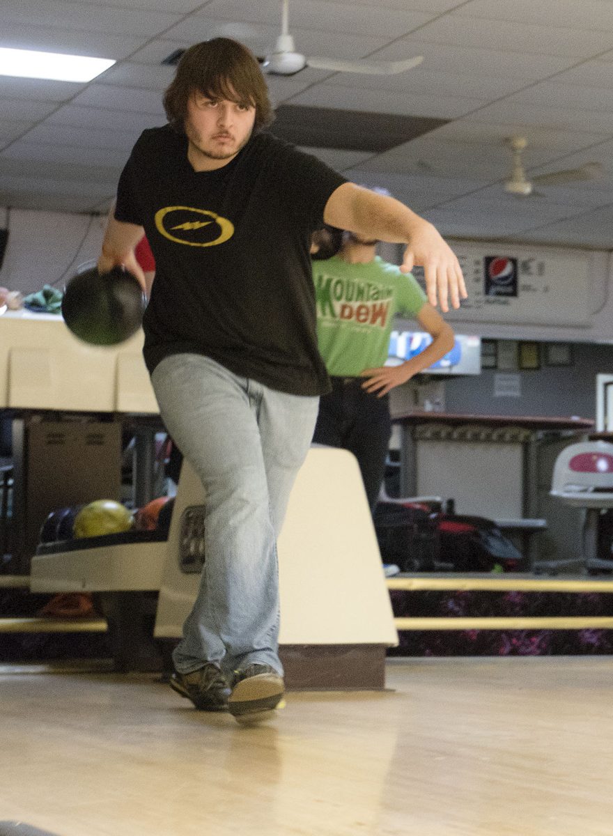 Casey Doyle, head coach of Emporia High School bowling team and sophomore marketing major, demonstrates for the student athletes during practice at Flint Hills Lanes. Doyle has a long history of bowling, including 10 years of bowling, bowling camps and assistant coach position for EHS last season.