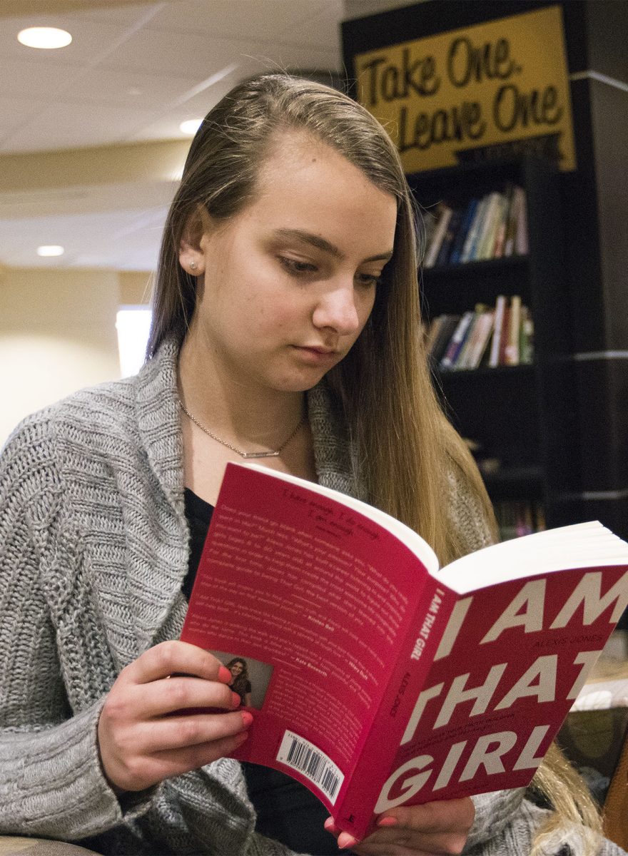 Chieko Zimmerman, president of I Am That Girl and freshman elementary education major, reads &#8220;I Am That Girl&#8221; written by the organization Tuesday in the Memorial Union. Chieko started the local charter because she recognized that there was a lack of femenist groups on campus.&#160;