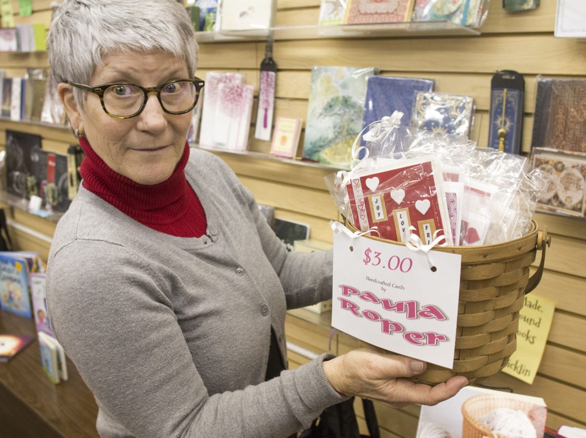 Maria Lawrence, owner of Ellen Plumb&#8217;s City Bookstore, 1122 Commerical St., displays some of the items Tuesday in her store that will be available during the Valentine&#8217;s Day sale from Feb. 12 to 14. Other stores that will also have Valentine&#8217;s specials include The Sweet Granada, 803 Commercial St., Designs by Sharon, 703 Commercial St. and Twin Rivers Winery and Gourmet Shop, 627 Commercial St.
