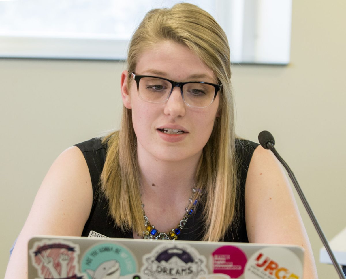 Caylie Ratzlaff,&#160;sophomore secondary education social sciences and English major, reads from the resolution regarding sexual harassment on Thursday March 15 in Senate Chambers. The resolution condemned the university's actions in handing sexual assault on campus, and passed 9-2-9.&#160;