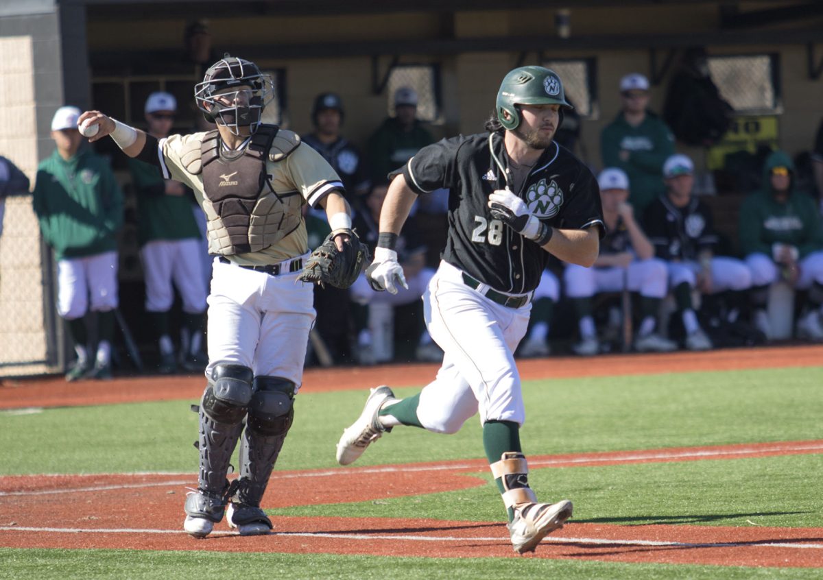 Taylor Sanagorski, senior catcher, throws out the Northwest Missouri State runner at first base Monday at Trusler Sports Complex. The Hornets lost all three games this week and have a 6-7 record.&#160;