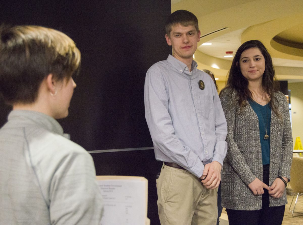 Christina Brunton, election commissioner and senior information systems major, announces the results of the Associated Student Government elections Thursday in the Center for Student Involvement where Michael Webb, senior business administration and music major, and Michaela Todd, junior communication and political science major, were named the ASG president and vice president. New senators for the different colleges were also announced.