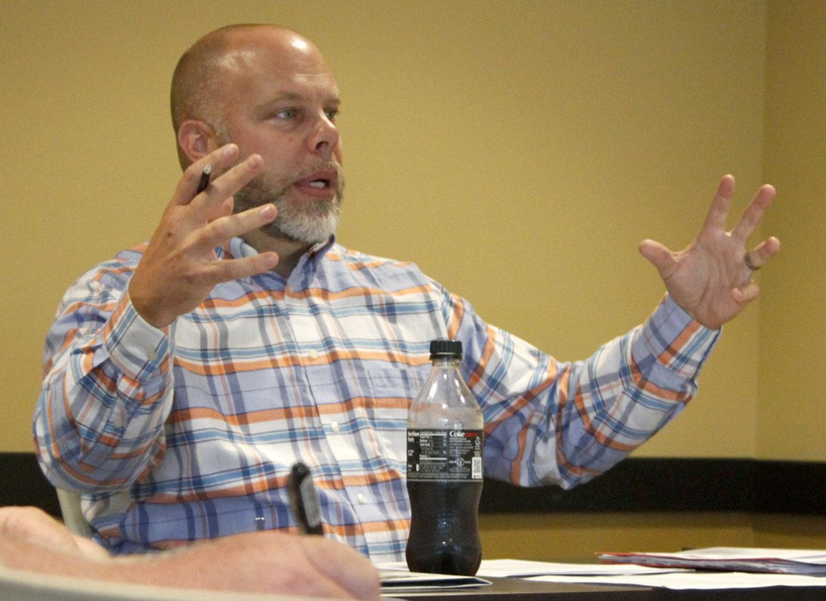 Steve Lovett, assistant professor of business administration, stresses a point he makes during the Faculty Senate meeting Thursday.