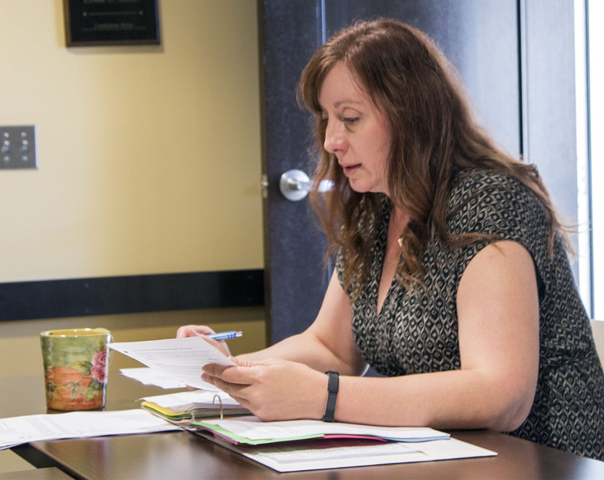 Brenda Koerner, chair of the Academic Affairs committee and professor of biological sciences, reads through a proposed policy for expedited&#160;programs. The Kansas Board of Regents is looking at revising the current&#160;policy to allow for an expedited process at both the campus and KBOR&#160;level.