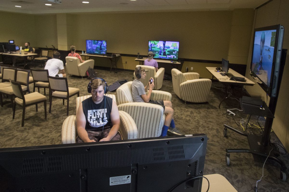 Luke Larson, graduate student in biology, and other participants play in the Fortnite competition Sunday in the Kanza Room of the Memorial Union. Each competitor was ranked by the number of kills and first place won a $100 cash prize.