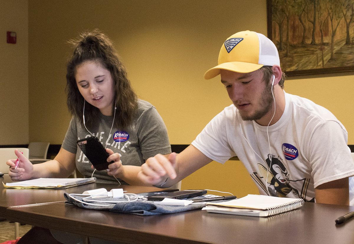 Mackenzie Haddix, freshman elementary education major, and Elliot Kobiskie, freshman accounting major, made phone calls on behalf of the Kobach campaign last Monday. If the students made 125 calls to voters, they would recieve a Kobach t-shirt.&#160;