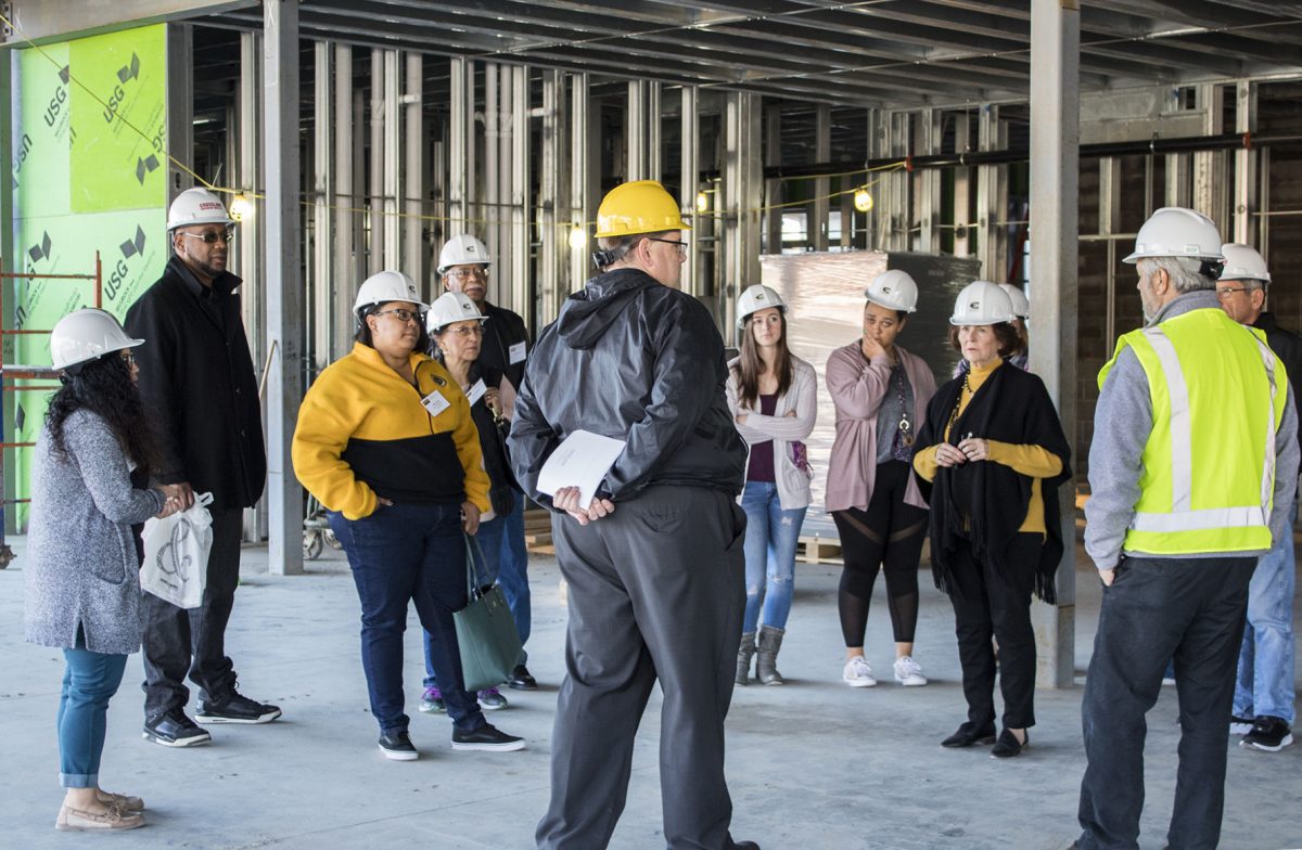 Javier Esteban, architect from KWK Architects of St. Louis, describes what is left to finish for Schallenkamp Hall&#8217;s construction during the hard hat tour last Saturday. The tours were a part of the Homecoming events and gave visitors a sneak peek into Schallenkamp&#8217;s structure.&#160;