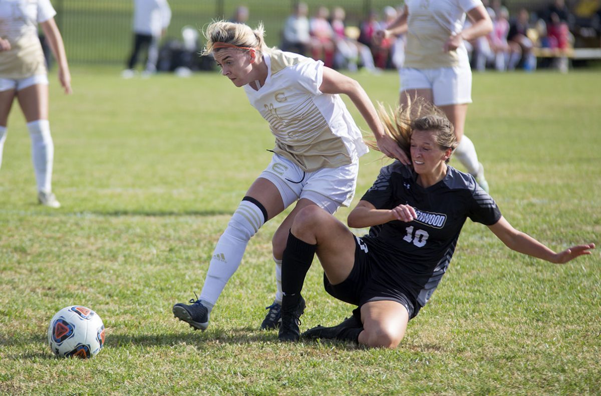 Chole Flynn, junior defender, fights to get the ball away from a Lindenwood player last Friday at home. This game brought the team&#8217;s overall season record to 11-4-1.