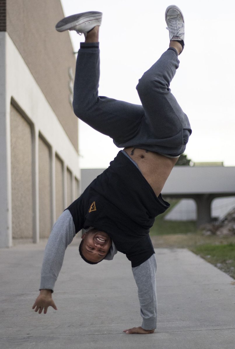 Jawaun Wallace, senior communication major, practices street dancing on Tuesday by the student recreation center. Wallace, who has been involved in street dance for over eight years, competes in competitions around the country.