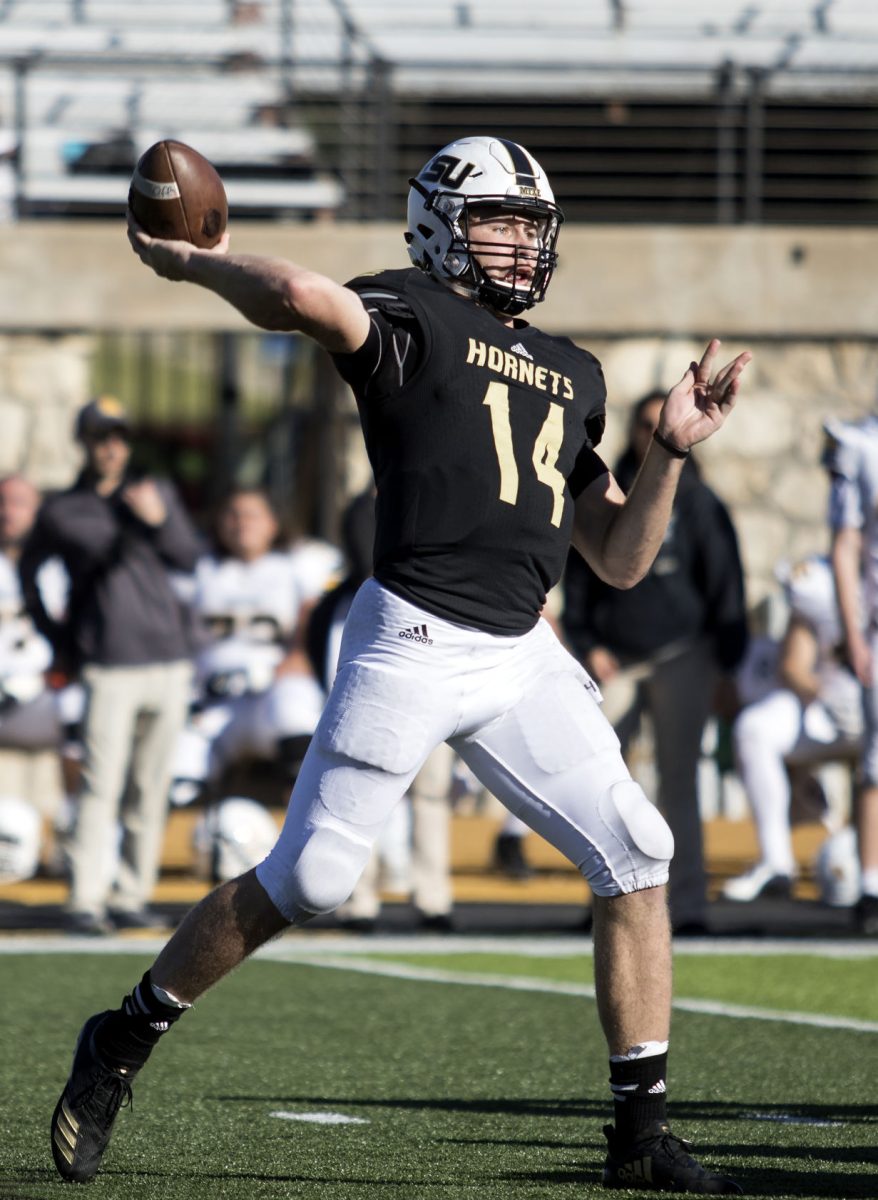 Braxton Marstall, senior quarterback who now holds the record of 9,531 total offensive yards, according to the ESU Hornet Football Twitter account, looks for a receiver during the Homecoming game against Missouri Western Saturday at Welch Stadium. The Hornets lost in the fourth quarter, 28-42.&#160;
