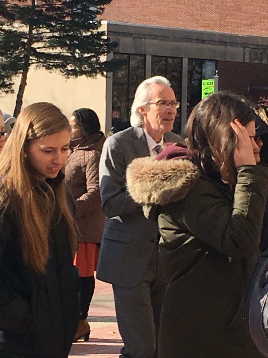 David Cordle, provost, stands near students and faculty members after a false fire alarm caused an evacuation of Plumb Hall yesterday. They stood in record low temperatures during a wind chill advisory until maintenance could fix the alarm.