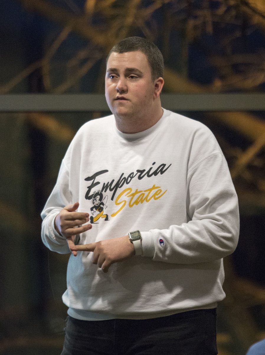 Dylan Schneider, ASG elections commissioner and sophomore elementary education major, speaks to a group of students interested in running for ASG president, vice president or senator on Monday in Skyline. Potential candidates must get students to sign a petition in favor or pay $30 in order to run for senator.