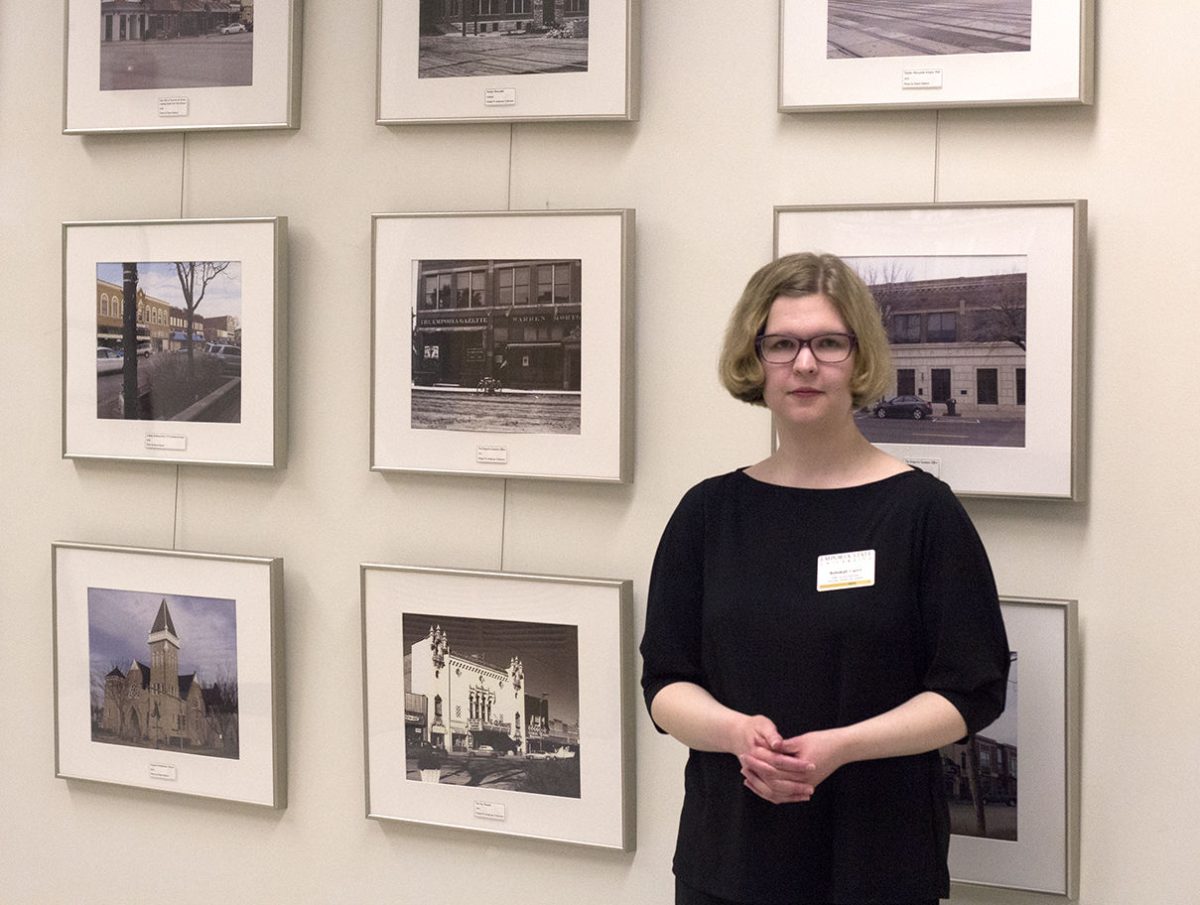 Rebekah Curry, public service supervisor of library and archives, is ready to&#160;answer questions from viewers Friday in the White Library. The photographs will stay in the library throughout the semester.
