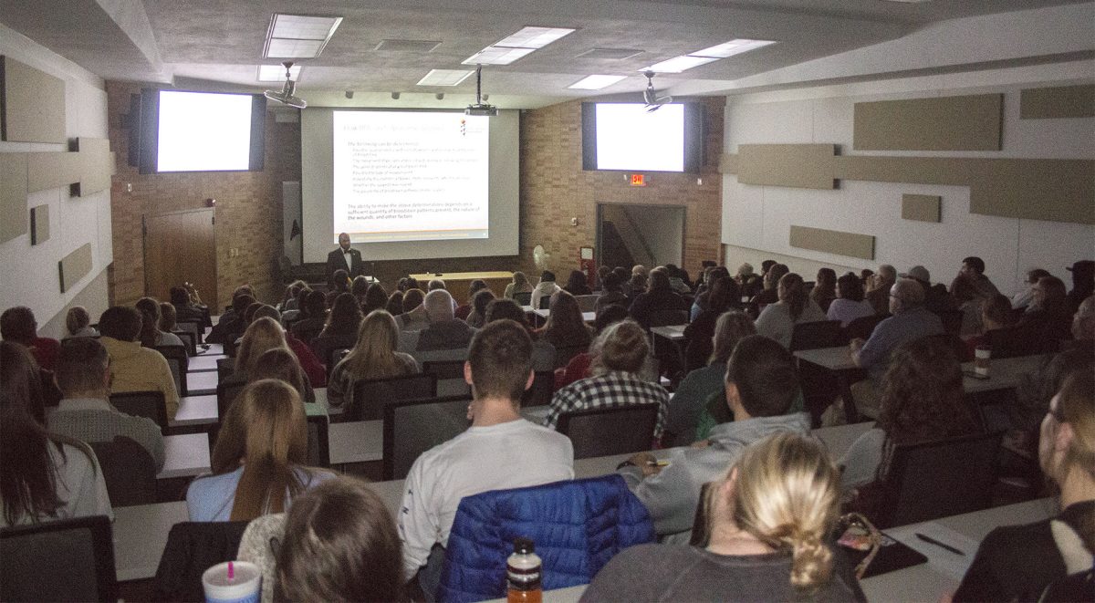 Jeremiah Morris lectures on bloodstain analysis patterns last Monday in the Science Hall. More than 50 people attended the lecture in Science Hall room 72.
