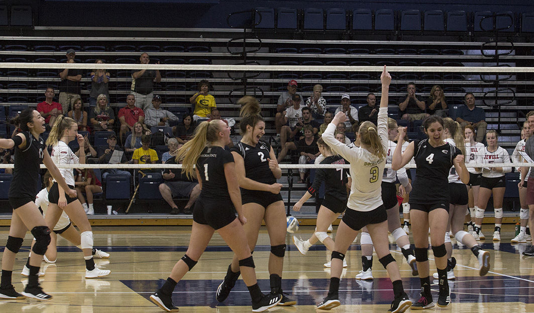 Volleyball players celebrate after scoring a point in their set against William Jewell on Sept. 6 in Topeka. They play next this weekend at the Mountain Lion invatational in Denver, Colorado.&#160;