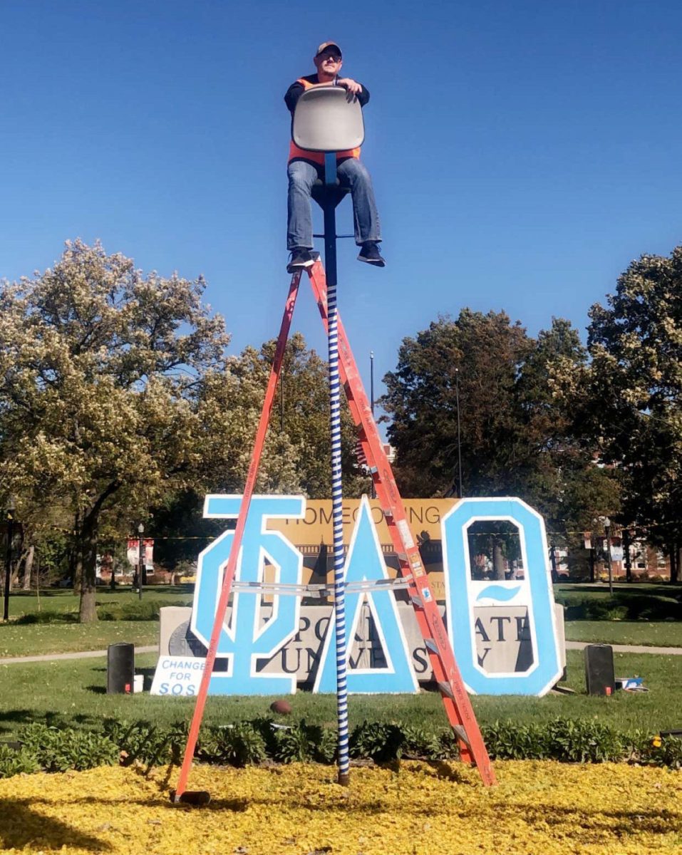 Daniel Baldwin, Emporia State and Phi Delta Theta alum takes a turn sitting on the pole during the annual pole sit. The pole sit is a fundraiser where Phi Delta Theta members sit on a 12.5 foot pole for 24 hours. All proceeds go to SOS, the domestic violence shelter in Emporia.