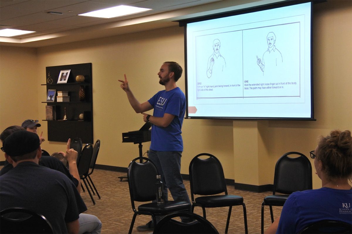 The president of the ASL club, Garrett&#160;Tatro, teaches students numbers in sign language. The club started learning on Sept. 7.&#160;