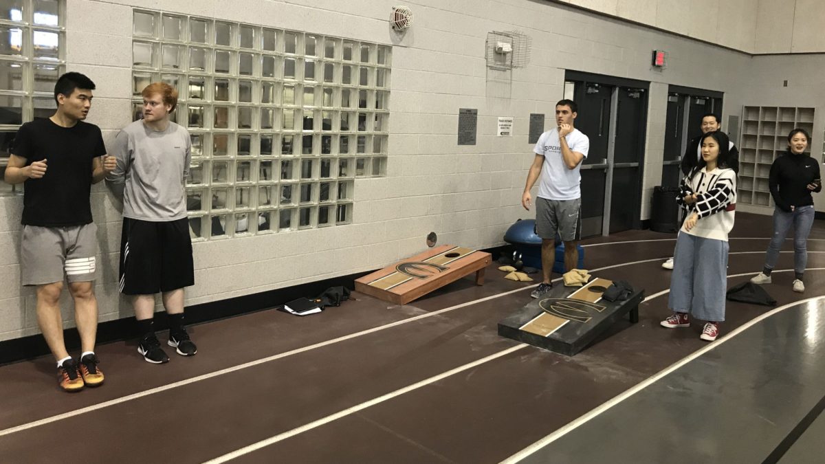 Graduate students participate in the first official Corn hole tournament in the gym of the Student Recreation Center on Nov. 6. Dustin Gruber and Logan Stuke won 21-17.&#160;