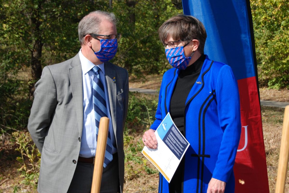 University of Kansas chancellor Doug Girod and Gov. Laura Kelly chat during a recent groundbreaking ceremony at the University of Kansas in Lawrence.