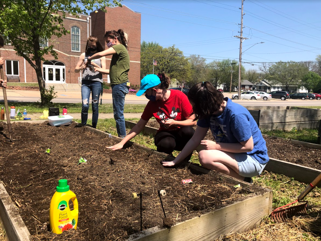 Students help plant seeds at the new garden plot on Sunday, April 11. Located at
United Grace Methodist Church in Emporia, the student-run plot is now operational.