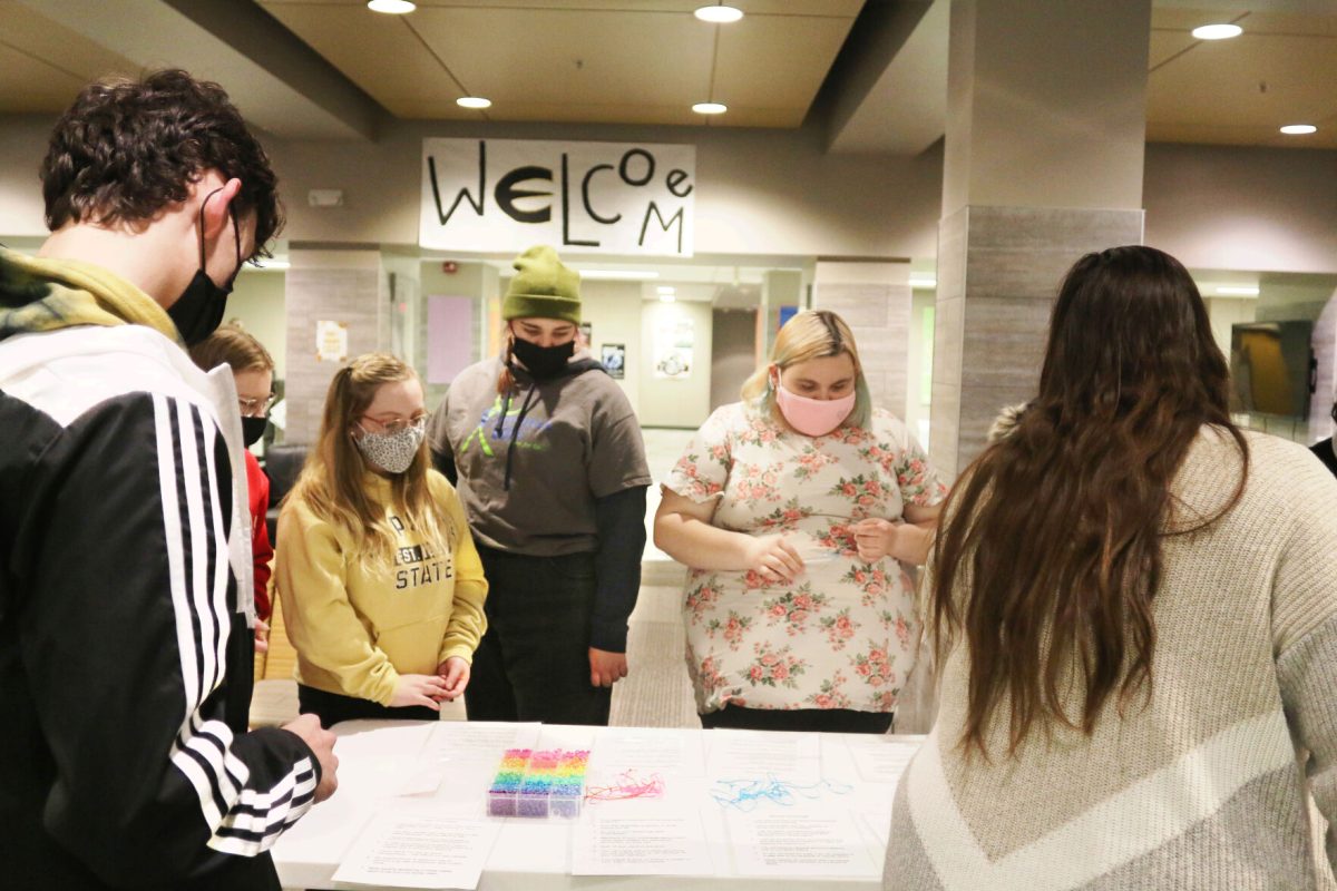 Towers Complex residents participate in a privilege bead activity on Feb. 22. Each color bead represented a different kind of privilege; For example, red beads represented race, purple represented class and blue represented sexuality.