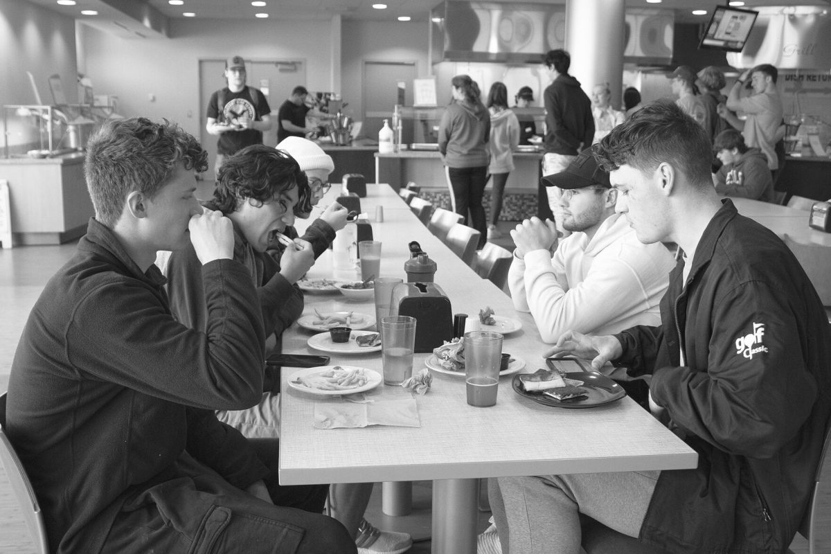 Sophomore business major Clayton Epley, senior communication major Evan Havran and junior marketing majors Ross Ehrsam, Blake Olmsted and Adam Hernandez eat lunch together on Monday in the Hornet&#8217;s Nest.