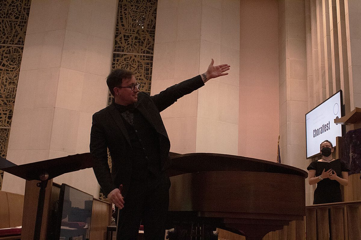 Michael Brown, Junction City High School conductor guides his students through their pieces during Choralfest.&#160;