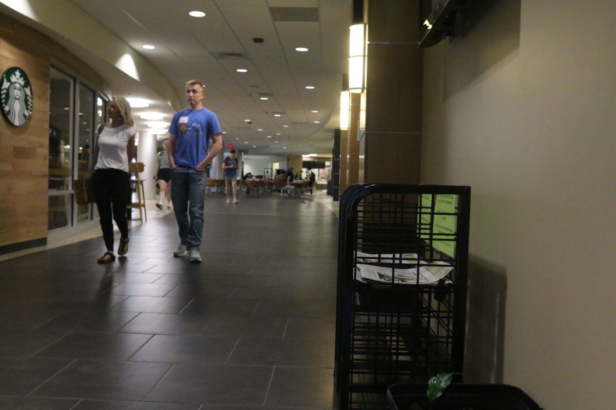 Prospective Emporia State students walk down the Mermorial Union near the Starbucks and The Bulletin distribution box during a college visit to ESU on April 19. Following the April 14 issue, the Memorial Union distrabution boxes had been tampered with, with manilla folders covering the cover page.
&#160;