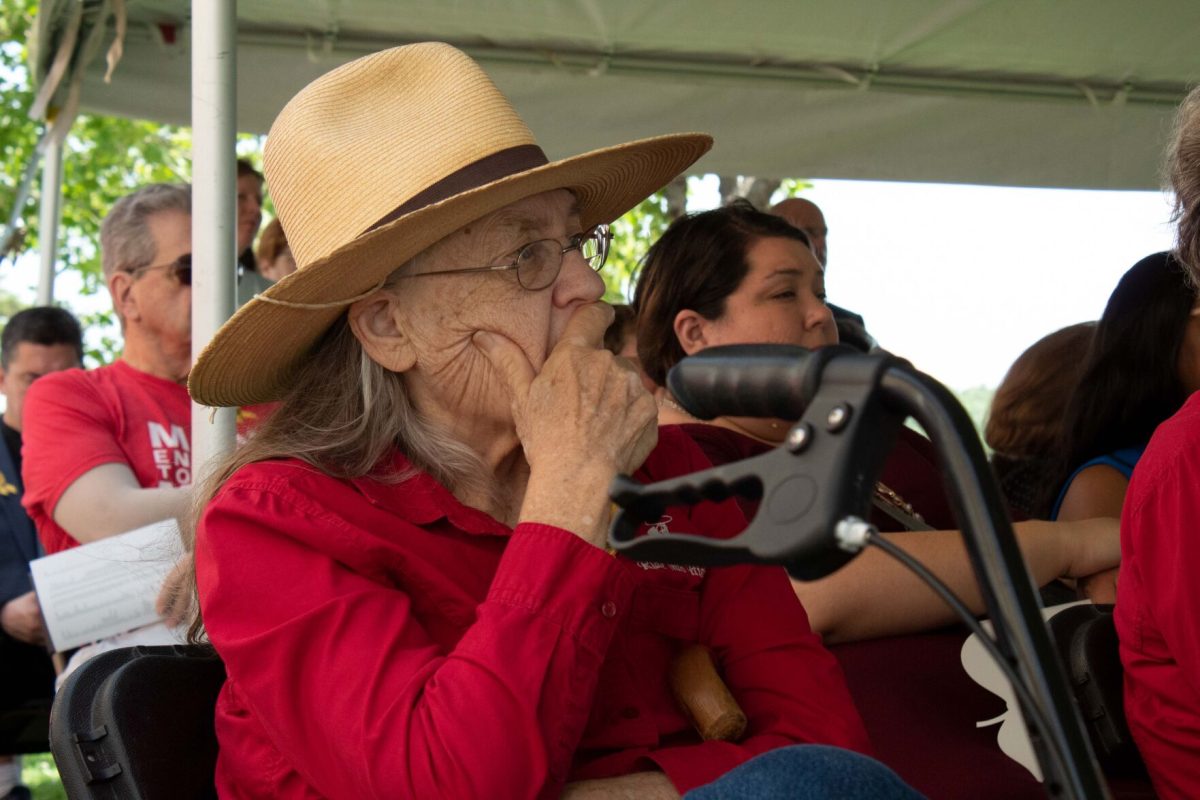 Joyce Thierer, former professor at Emporia State, listens to speakers honor educators lost in the field on Friday. This was Thierer's first time at a rededication ceremony for the National Memorial to Fallen Educators and she wanted to honor those devoted to protecting their students.&#160;