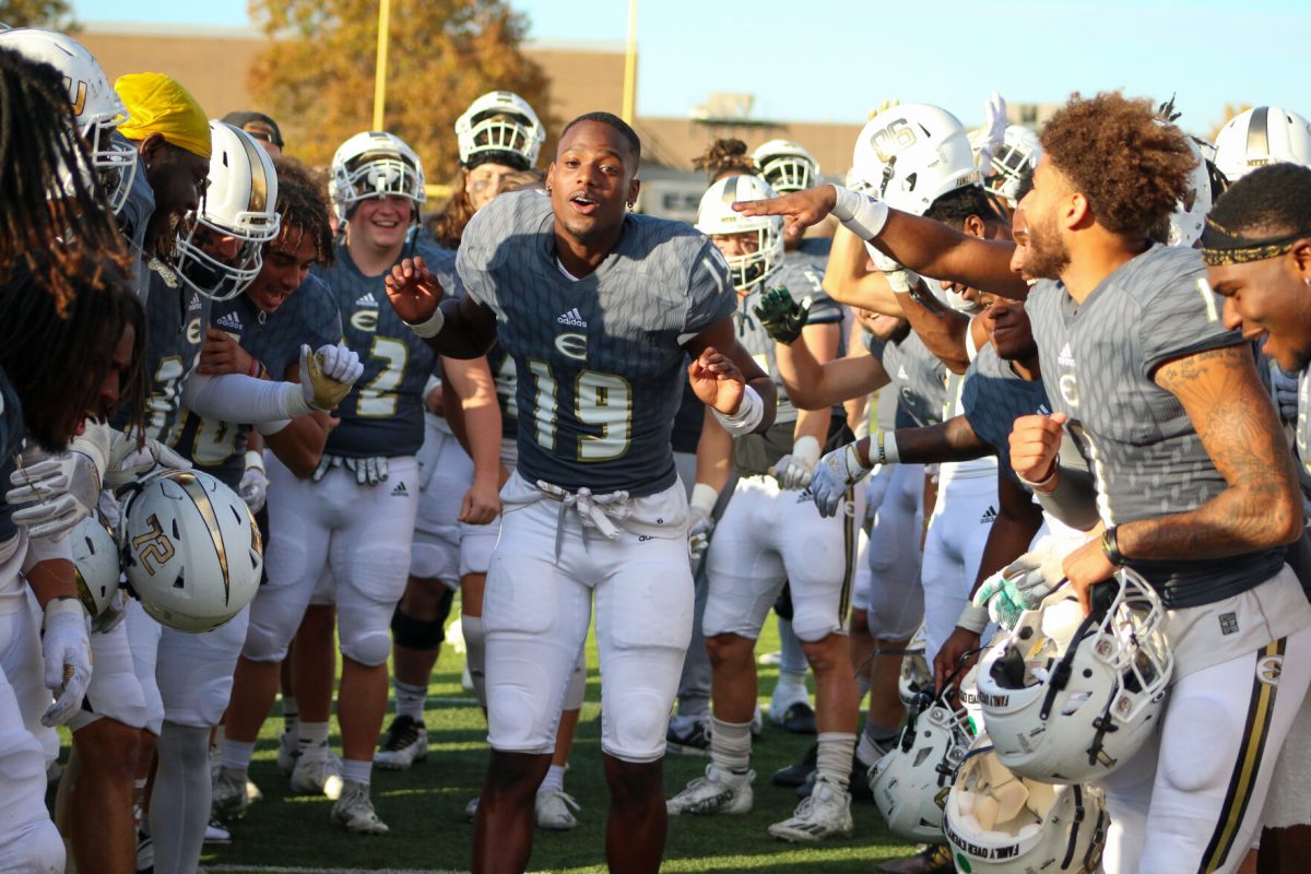 Defensive back Roderick Farmer celebrates with the rest of the Emporia State football team at the conclusion&#160;of the win over Fort Hays.&#160;