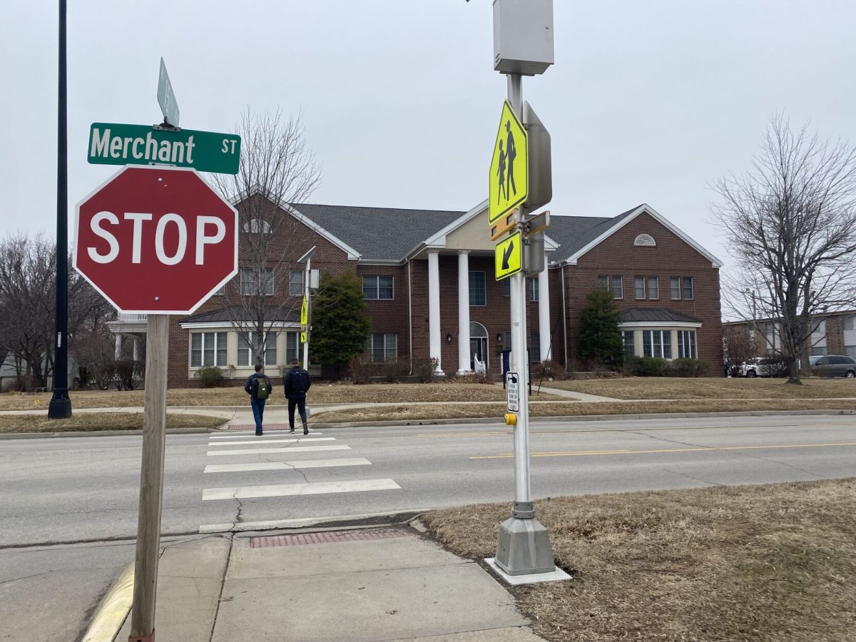 Emporia State students use the crosswalk and warning lights located on 1500 Merchant Street to get to the other side. The warning lights installed were used at the scene of the accident last night.&#160;