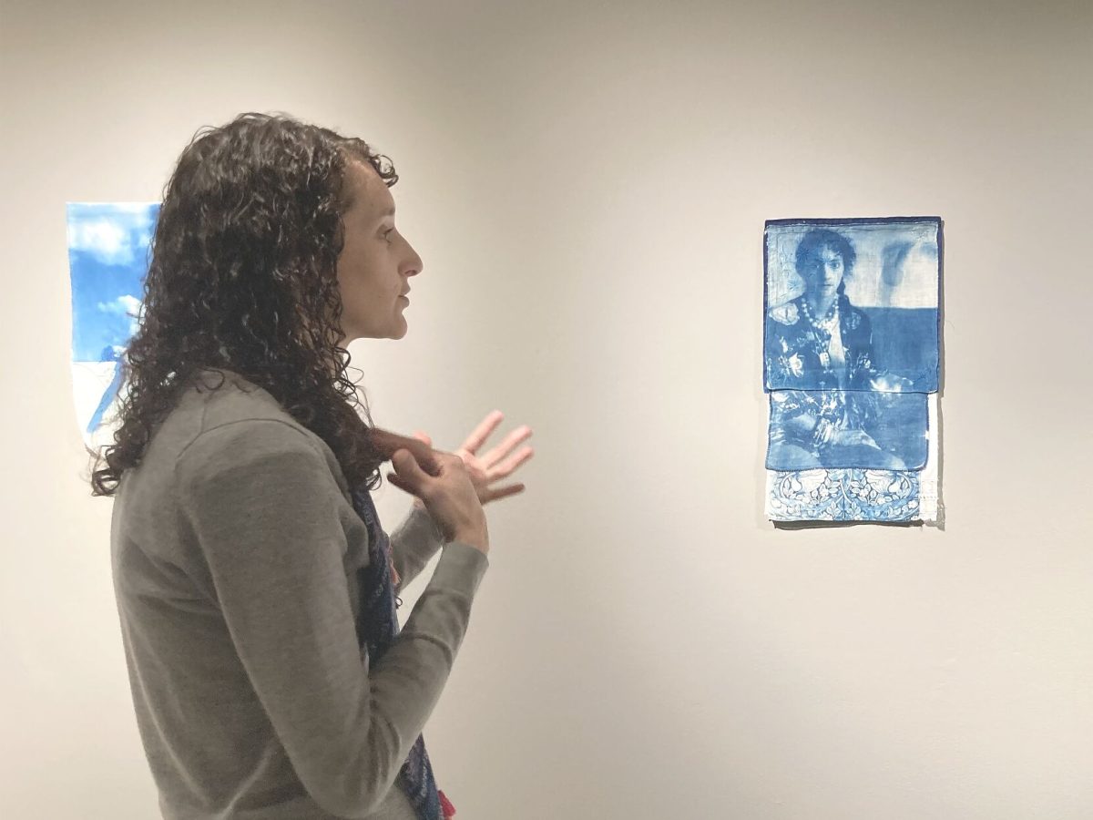 Morgan Ford Willingham stands in front of &#8220;Untitled (avocado)&#8221; in her solo show &#8220;Notions &amp; Impressions&#8221; in Eppink Gallery in King Hall. Willingham&#8217;s show will last until March 10.