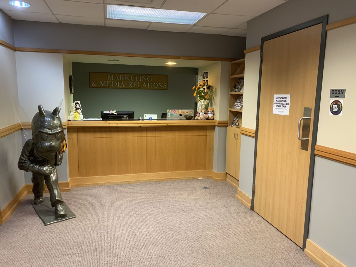 Emporia State Marketing and Media Relations front desk sits empty at 3 p.m. today as the door leading to the office of Gwen Larson, director of media relations and internal communication, is closed with a sign reading &#8220;AUTHORIZED MARKETING + COMMUNICATION STAFF ONLY Please see front desk for assistance.&#8221;