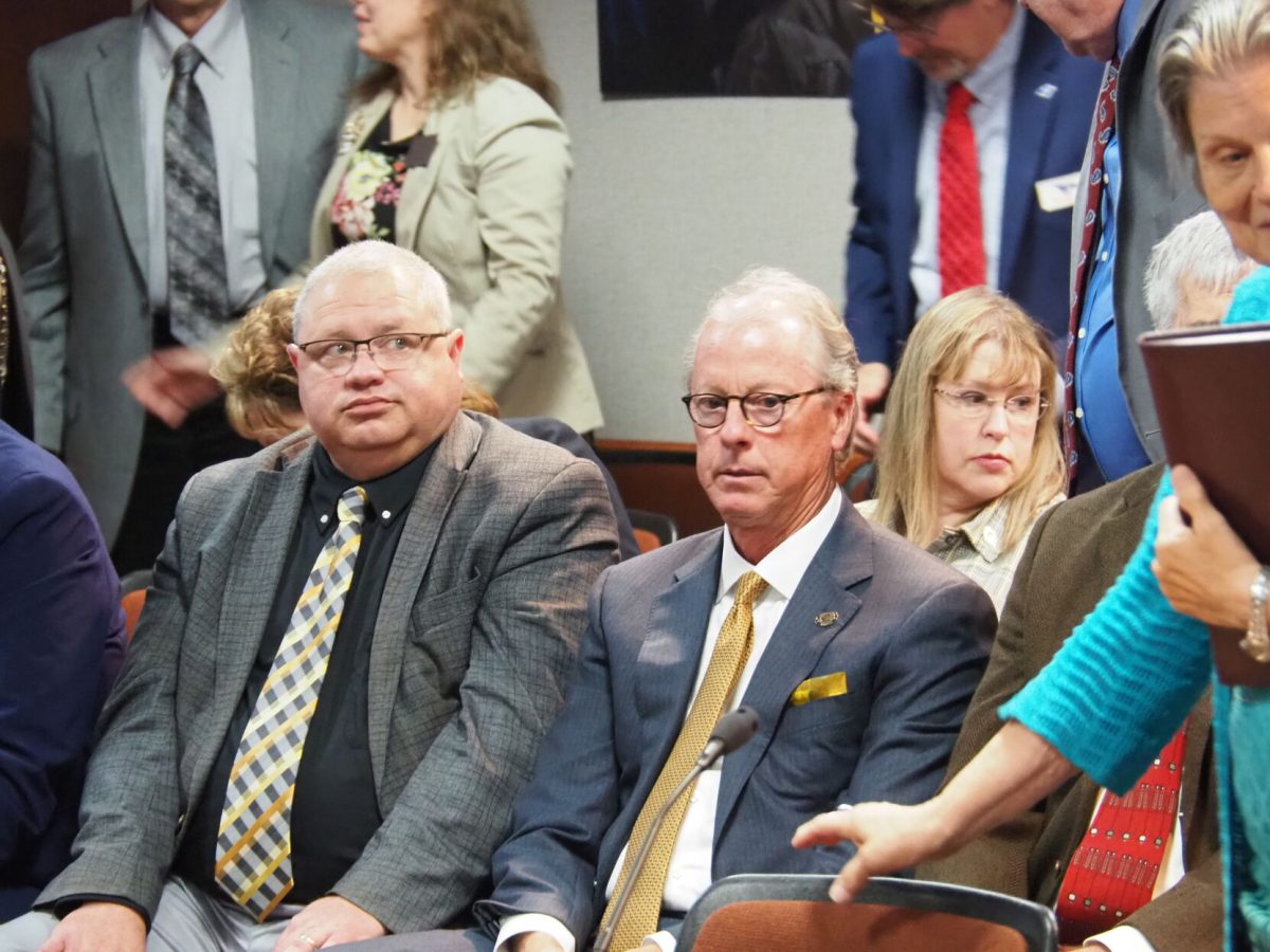 Emporia State University president Ken Hush, right, received approval from the Kansas Board of Regents to deploy a policy designed to expedite personnel and program reform. (Tim Carpenter/Kansas Reflector)