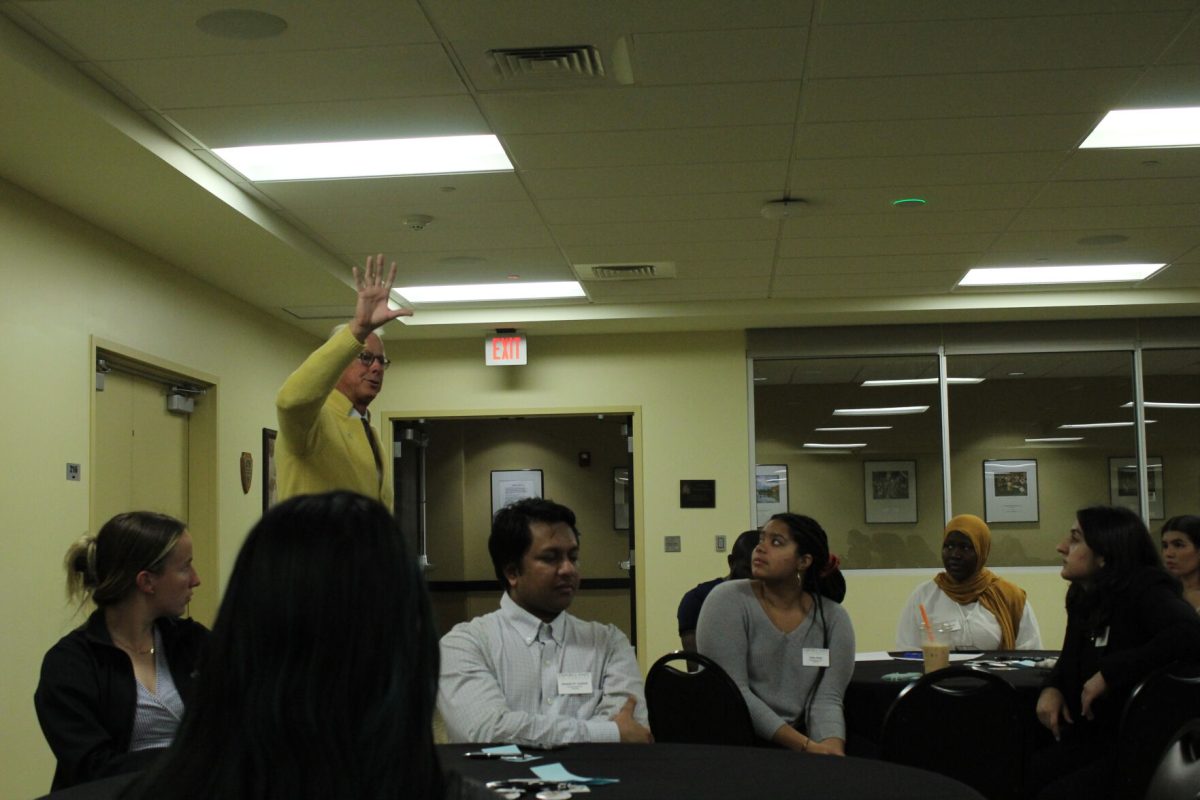 President Hush speaks to members of ASG and one student at Wednesday's town hall meeting. The meeting was sponsored and organized by ASG.