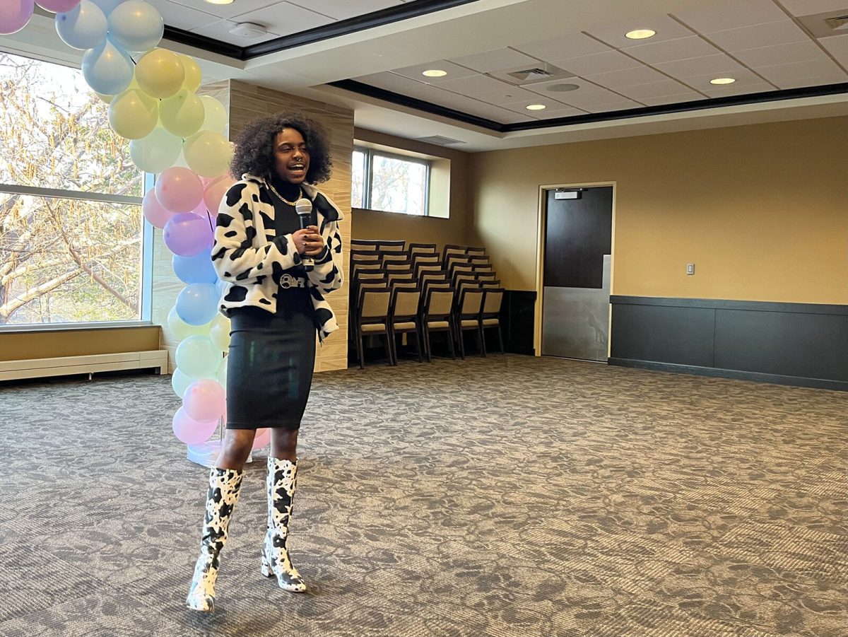 Percy Holt, a senior interdisciplinary studies major, speaking at the event. At the event graduating seniors were recognized and given a small, but meaningful, graduation gift.